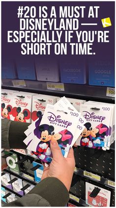 someone is shopping for disney merchandise at the store