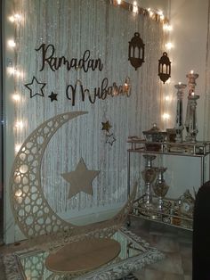 a room decorated with lights and decorations in the shape of a crescent, stars and moon