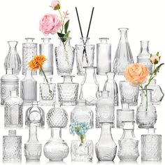 many different vases and flowers are arranged together