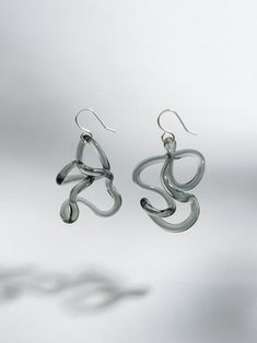 Catching light and hanging freely from your lobes - these earrings are a celebration of the unique nature of both the glass and the wearer. I flameworked these earrings from borosilicate glass. I then finished them with handmade sterling silver hooks. These earrings measure approximately 42mm from silver hook to base of earring. I make each of these to order, so please know that the above image is simply an example, and yours will be just as lovely. I make my wearables with borosilicate (pyrex) Pebble Ring, Pyrex Glass, Rings Cool, Large Earrings, Wire Earrings, Pyrex, Everyday Jewelry, Organic Shapes, Handmade Sterling Silver