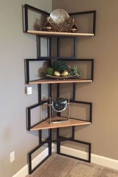 a corner shelf in the corner of a room with some decorations on top of it