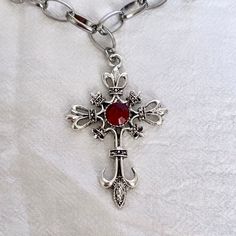 This silver gothic cross necklace boasts a vintage cross pendant, featuring grunge jewelry aesthetics, presenting a statement red cross necklace that's an ideal religious jewelry gift idea for her, especially for those who appreciate distinctive and edgy accessories. 𝐃𝐄𝐓𝐀𝐈𝐋𝐒:  ⭐️ Necklace length is 16" ⭐️ Pendant size is 1 15/16" x 2 1/8" ⭐️ The silver cross pendant is silver plated over alloy. The chain necklace is up on stainless steel, safe for those with sensitive skin ⭐️ The best sta Kawaii, Silver Cross Necklace Aesthetic, Red Cross Necklace, Gothic Cross Necklace, Grunge Jewelry, Edgy Accessories, Gothic Cross, Gothic Crosses, Silver Cross Pendant