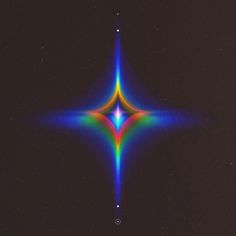 an image of a multicolored star in the dark