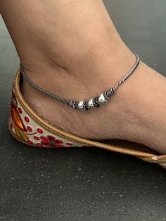 A beautiful pair of anklets handcrafted in brass and antique polish. Hook Closure  Weight: 30 grams per pair  Length of Anklets: 10 inches. Handmade Adjustable Anklets, Traditional Anklets With Oxidized Finish For Festival, Bohemian Metal Anklets With Oxidized Finish, Adjustable Metal Traditional Anklets, Traditional Metal Anklets For Gift, Traditional Metal Anklets As Gift, Traditional Adjustable Metal Anklets, Metal Anklets With Silver Beads For Festivals, Bohemian Oxidized Anklets With Adjustable Fit