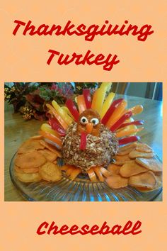 a turkey made out of cookies on top of a glass plate with words thanksgiving turkey cheeseball