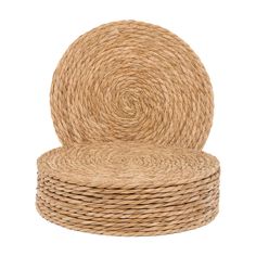 three round straw coasters stacked on top of each other, one with a spiral design