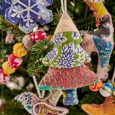 a christmas tree with ornaments hanging from it