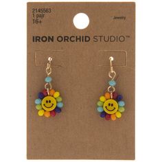 the iron orchid studio earrings with smiley face on each earring is made out of plastic beads