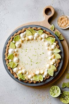 a pie with limes and marshmallows on it