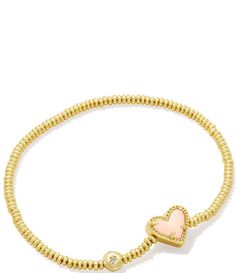 From Kendra Scott&#x2C; this bracelet features:Stretch bracelet14K gold over brass Stretch&#x2C; no closure Approx. 6.5" unstretched length Imported. Elegant Gold Stretch Bracelet With Heart Beads, Adjustable Gold Stretch Bracelet With Heart Charm, Adjustable Yellow Gold Bracelet With Heart Beads, Gold Stackable Heart Bracelets, Gold Heart-shaped Stackable Bracelets, Gold Charm Bracelet With Heart Charm And Adjustable Fit, Gold Adjustable Heart Shaped Stretch Bracelet, Adjustable Gold Heart Stretch Bracelet, Adjustable Gold Heart-shaped Stretch Bracelet