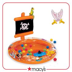 an inflatable toy with a pirate sign on it and other toys around it