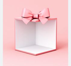 an open box with a pink bow on it's top and the lid is empty