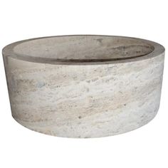 a white marble bowl sitting on top of a table