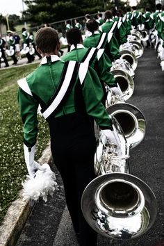 a marching band is lined up on the street