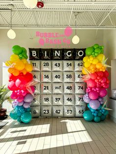 balloons are arranged in the shape of numbers on a calendar display at a birthday party