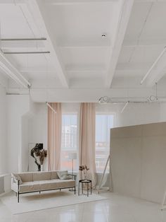 an empty living room with white walls and flooring