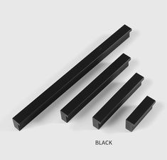 four pieces of black plastic on a white background