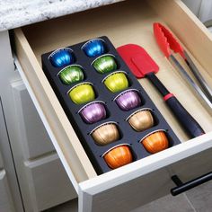 an open drawer with utensils in it