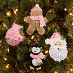 three ornaments are hanging from a christmas tree