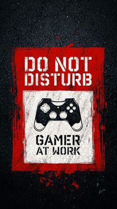 a red and black sign with a game controller on it that says do not disturb