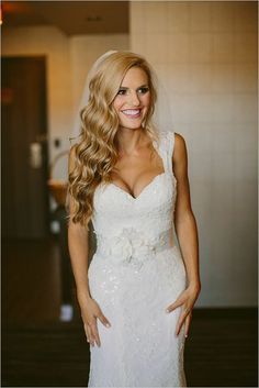 a woman in a wedding dress posing for a photo