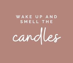 the words wake up and smell the candles are in white lettering on a pink background