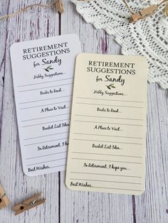 two retirement suggestions cards sitting on top of a white wooden table next to clothes pins