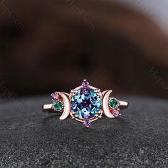 Engagement Ring ►Material: Available in Silver & Solid 10K/ 14K/ 18k Rose/Yellow,/White,Gold ►Center stone: Round Cut [7mm] Alexandrite.  Side stone: Emerald, Amethyst ►For Solid Gold Ring:Accented with Moissanite(E-F color, VVS clarity. ) ►For Silver Ring:Accented with CZ Simulated Diamonds (5A, E-F color, VVS clarity. ) ►Carat Weight: 0.06 Carat.(Approx.) ►Band Width: Approx. 1.3mm(Bottom) ►Prong Setting,micro pave ► Customer Service ✓ Comfort Fit ✓ Free Gift Ring Box ✓ Free USA Shipping ✓ Custom Your Ring (Sketch 3D Renderings ) ✓14 Days Money Back ✓Complimentary Engraving is included ►Custom Order Custom design service, allows you to create a pendant, engagement ring, wedding or anniversary band that's as unique as the person wearing it. and you will receive a 3D renderings of your jew Ring Sketch, Ring Proposal, Engagement Ring Rose Gold, Alexandrite Engagement Ring, Zierlicher Ring, Ring Emerald, Solid Gold Rings, Rose Yellow, Proposal Ring