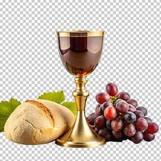 grapes, bread and a chalice on a table