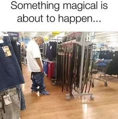 a man standing in front of a rack of clothes with the caption, something magic is about to happen