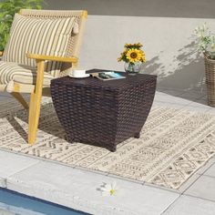 a chair sitting on top of a rug next to a pool