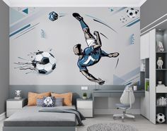 a bedroom with a soccer mural on the wall