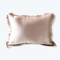 a pink pillow on a white background