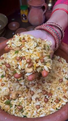 a person is scooping rice into a bowl