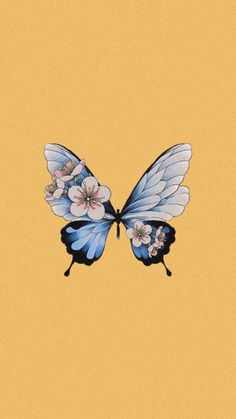 a blue butterfly with white flowers on it's wings is flying through the air