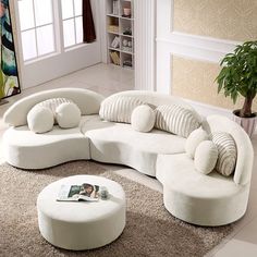 a living room filled with lots of white furniture