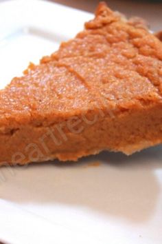 a piece of pumpkin pie on a white plate