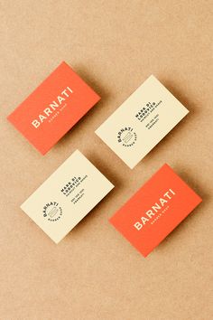 three business cards sitting on top of each other