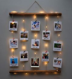 a wall hanging with pictures and lights on it's sides, which are decorated with string lights