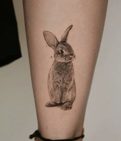 a small rabbit tattoo on the leg