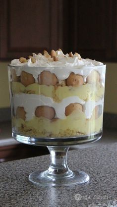 a cake sitting on top of a counter covered in frosting