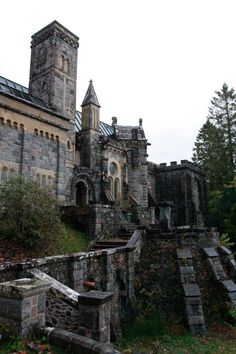 an old castle with stairs leading up to it