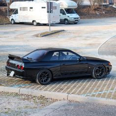 a black car parked on the side of a road