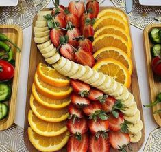 sliced fruit and vegetables arranged on trays