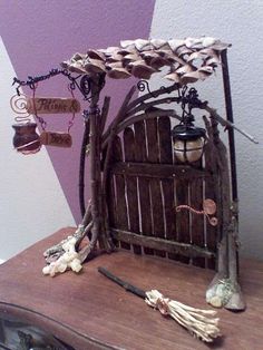 a wooden table topped with lots of different types of items on top of each other