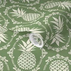 pineapple wallpaper in green and white with an ornate design on the back ground