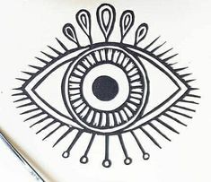 a drawing of an eye with spikes on it's sides and eyes drawn in black ink