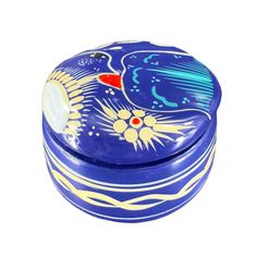 a blue and white box with an image of a bird on it's lid