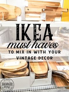 an assortment of wooden furniture in a store with text overlay that reads ikea must haves to mix in with your vintage decor