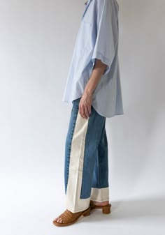 Vintage Reworked Slouch Jean in Indigo and Natural from B Sides. Made from a combination of reworked vintage jeans and natural cream side panels. Mid-rise with a slouchy fit, relaxed hip and wide leg. This style runs 1-2 sizes large, size down one size for the intended slouchy fit and 2 sizes for a more fitted look around the waist. These jeans have a longer inseam and can be worn slouchy, cuffed or you can cut for a raw edge finish like the Lasso. Re-made from authentic vintage Levi's 501's, co Sewing Projects Denim, Make Jeans Longer, Artistic Fashion Style, Upsize Jeans, Street Wear For Women, Panel Pants, Panel Jeans, Reworked Jeans, Reworked Clothes